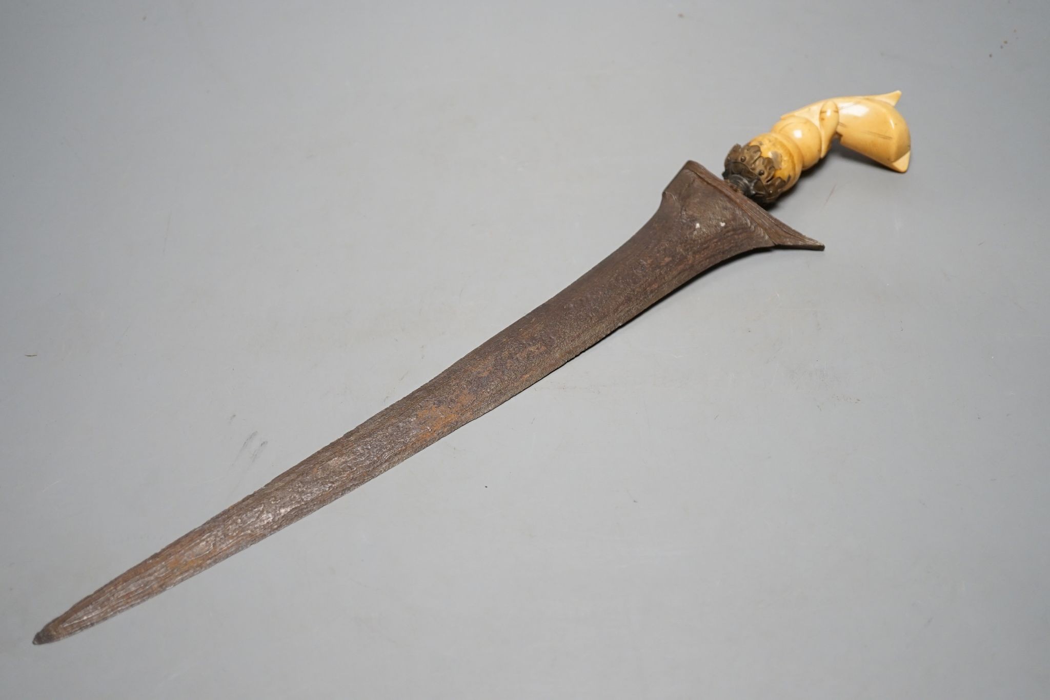 A 19th century ivory handled Kris, 40 cms long.